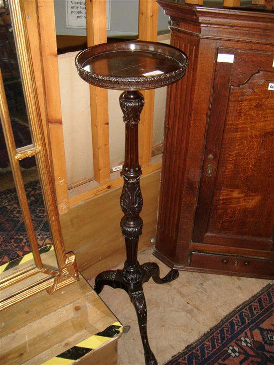 Carved mahogany torchere